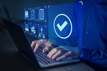  Manager or auditor working on computer.
